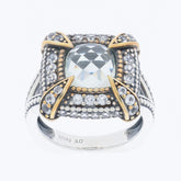Cushion white sapphire sterling silver ring with sapphire accent and gold detailing, showcasing timeless elegance.